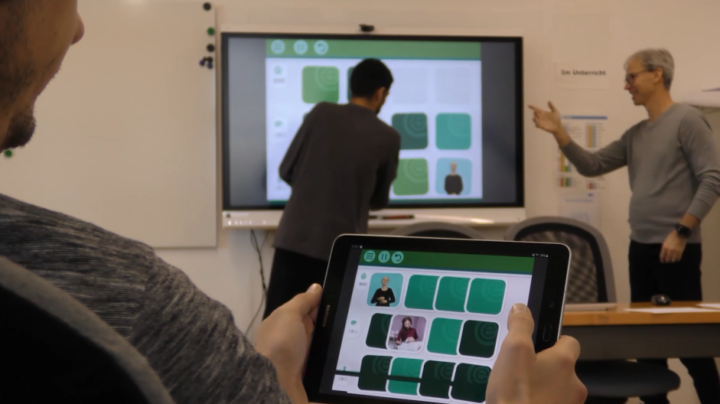 People playing Memory game with sign language on smart board and tablet